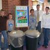 On far right, Whitley Intermediate Principal John Siler and Conservation District's Vickie Hart on America Recycles Day